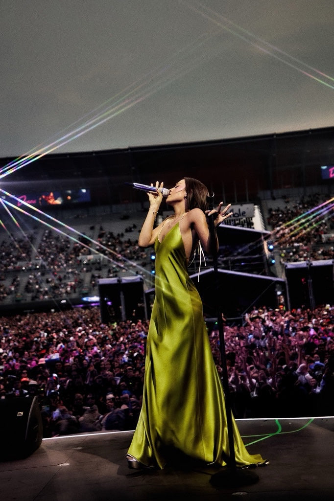 Danna performing at Vive Latino in a green dress, 2026